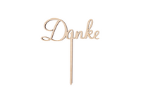 Ein Caketopper mit der Aufschrift Danke