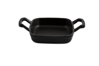 Eine schwarze Gusseisenpfanne mit Henkeln