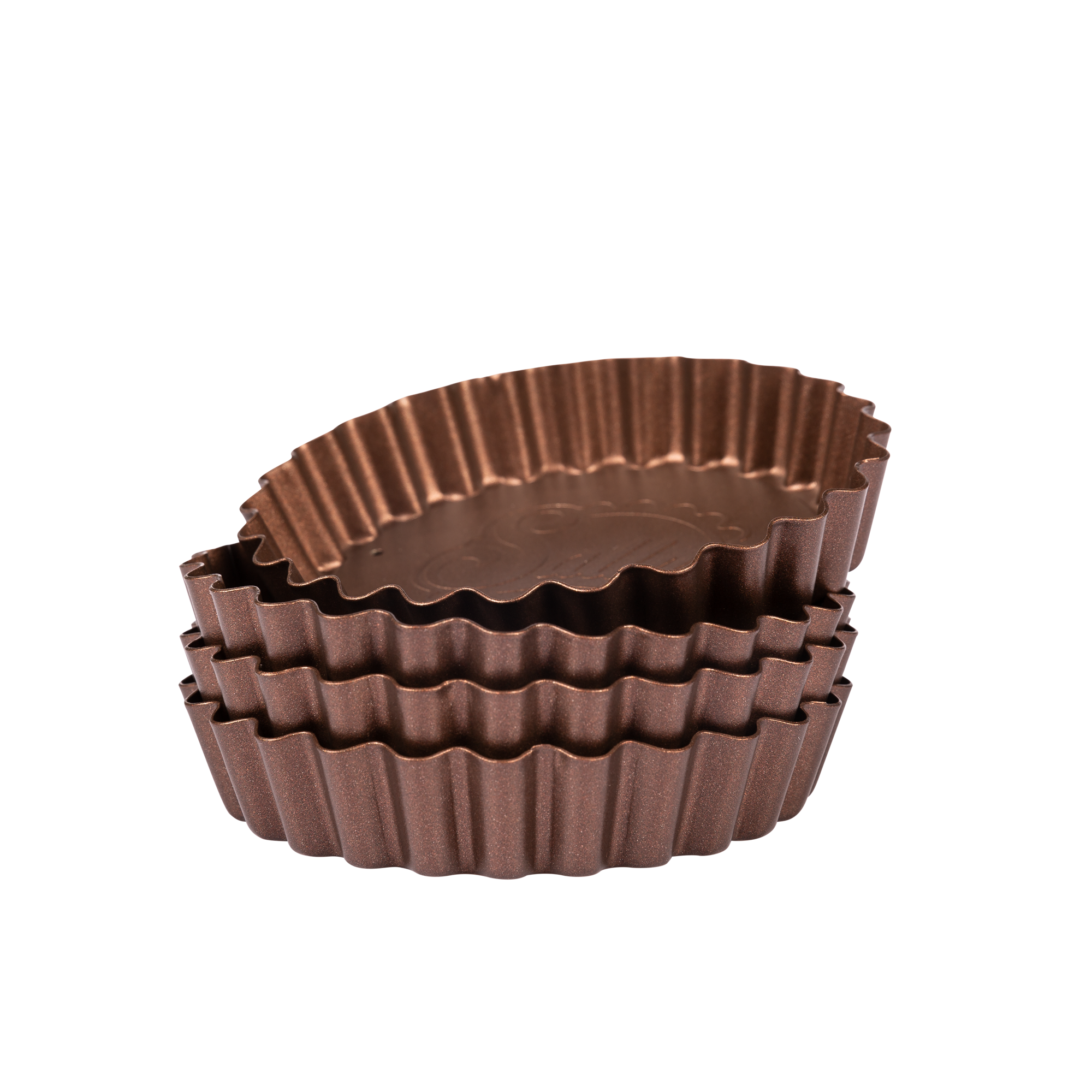 Mehrere kleine, kupferfarbene Tarteformen sind übereinander gestapelt