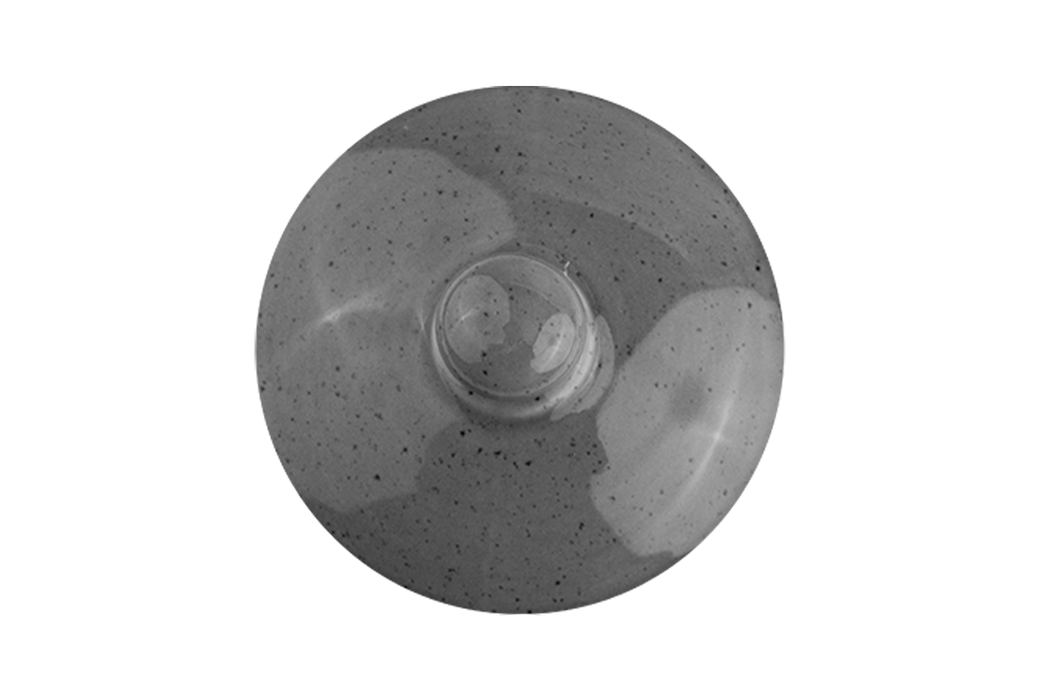 Der grau-gesprenkelte Deckel einer Teekanne