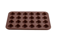 Eine kupferfarbene Mini Muffinform