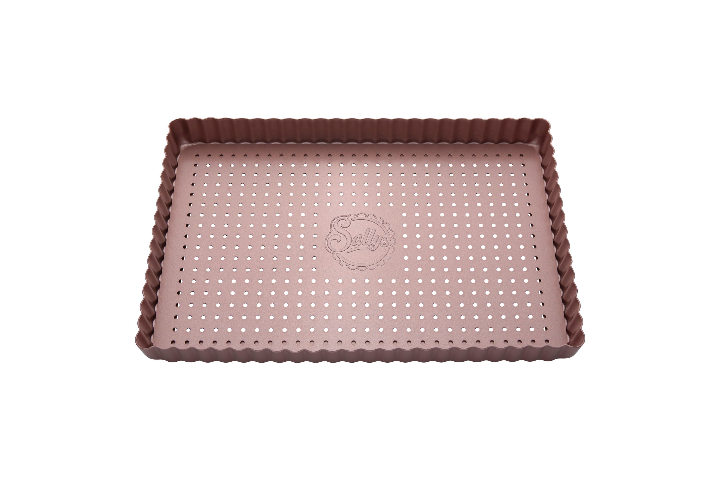 Eine rosefarbene, rechteckige Tarteform mit perforiertem Hebeboden