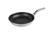 Eine kleine Wabenpfanne mit schwarzem Inneren und silbernem Griff
